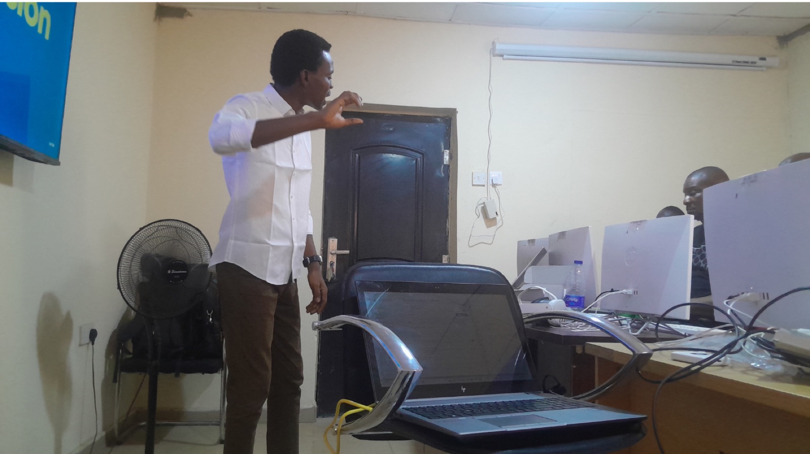 A facilitator standing and explaining a step to the room