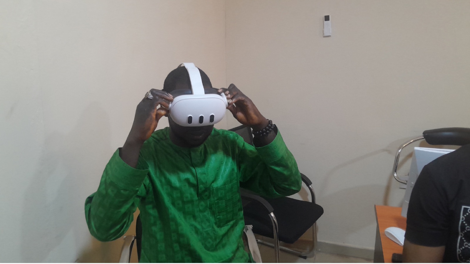 A participant adjusting a VR headset before a session